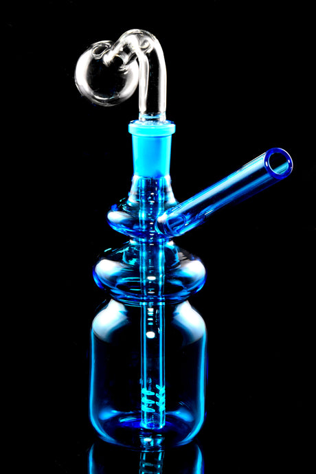 Blue bottle-style oil burner rig with 14.5 mm GoG joint, angled straw, and internal downstem, black background.