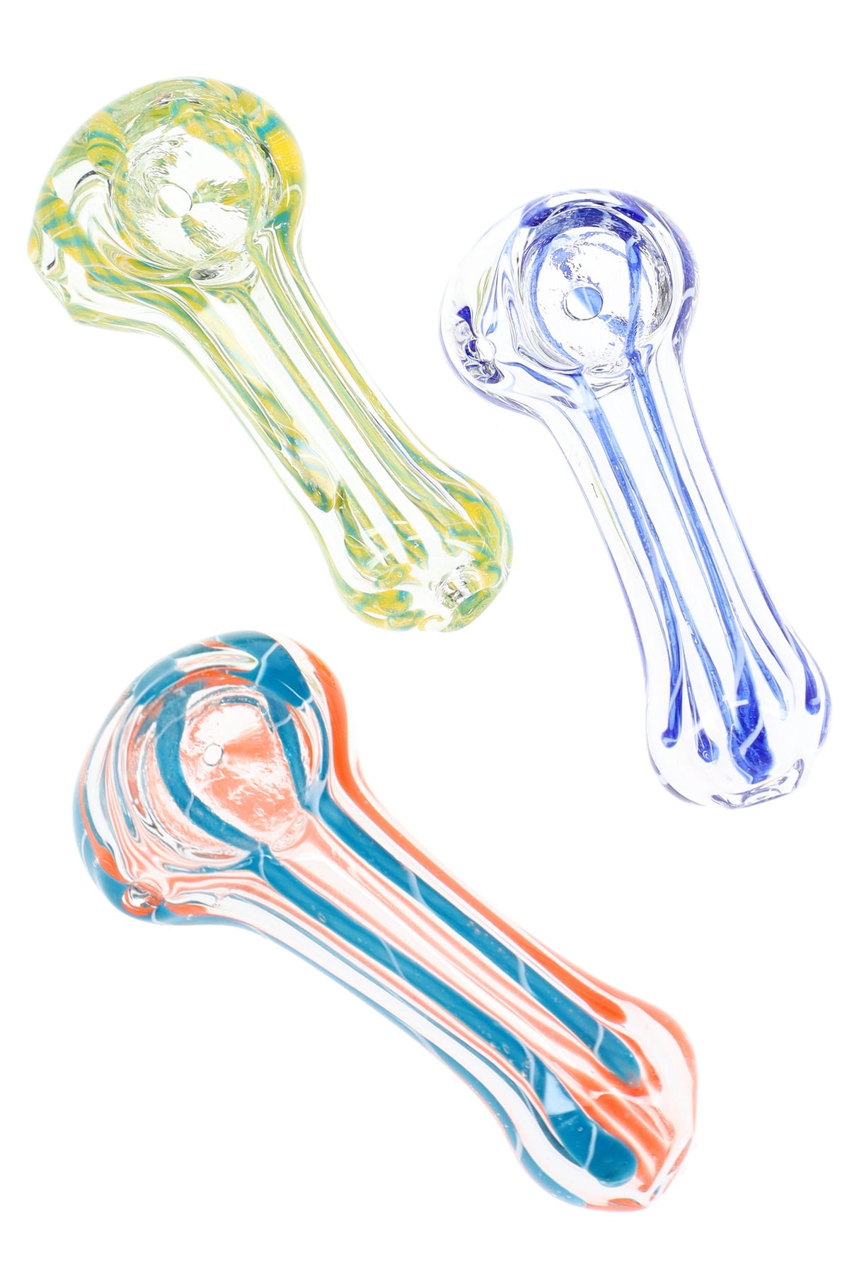 Trio of small striped glass spoon pipes in yellow, blue, and orange color combinations arranged diagonally on white background.