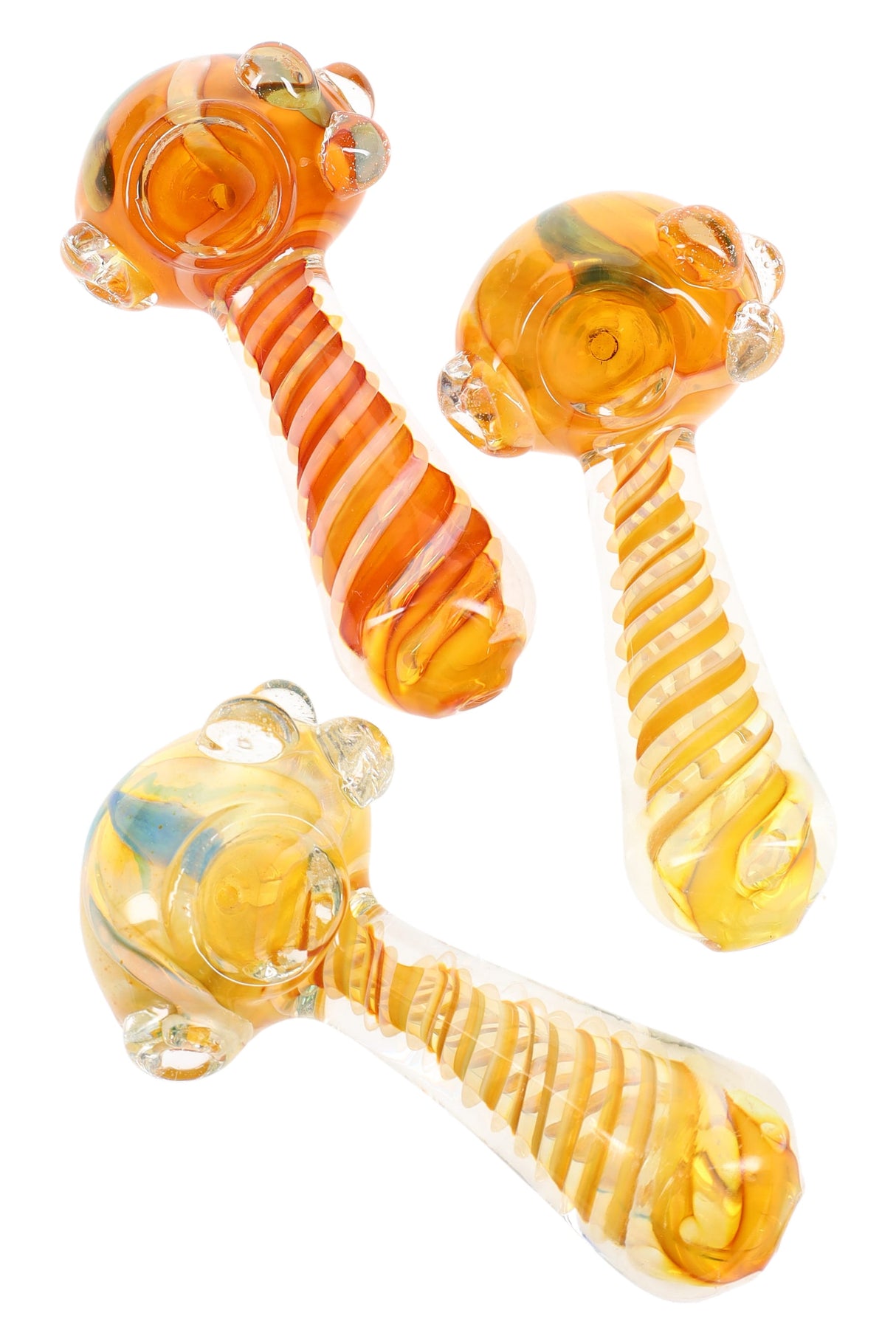 Gold-fumed glass spoon pipe with spiral swirl striping and bubble marble roll-stops around the bowl, shown in warm amber tones.