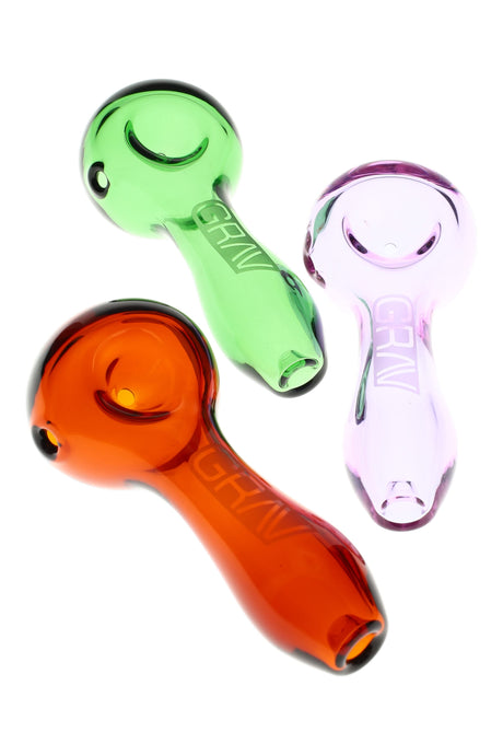 Compact 3.75-inch GRAV Classic spoon with inverted ash-catching mouthpiece, deep bowl, and side carb, shown in pink, green, and amber on white background.