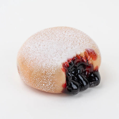 Front view of donut-shaped glass dry pipe showing recessed bowl and textured sugar coating.