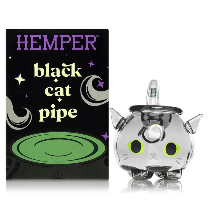 Hemper Black Cat glass hand pipe next to branded box, front view with cat face decal on cauldron bowl
