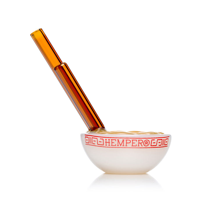 Ramen bowl novelty hand pipe with amber chopstick mouthpiece and red rim graphic, compact glass dry herb pipe view
