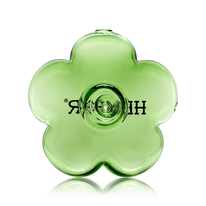 Front view of transparent green flower hand pipe showing symmetrical petals and compact size for easy grip and storage