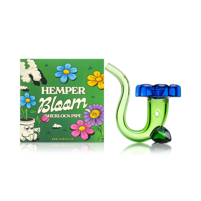 Hemper Bloom Sherlock pipe beside colorful retail box, green curved glass body and blue flower bowl cap on display