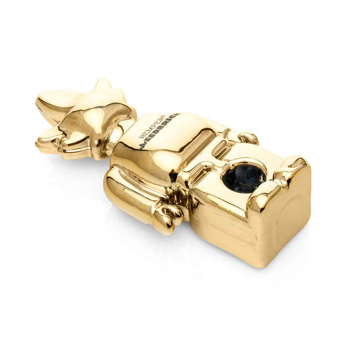 Angled top view of mirror-gold Weedbrick glass hand pipe lying down with bowl opening visible and dark bowl accent