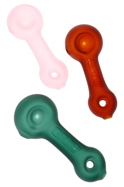 Three GRAV sandblasted mini spoon hand pipes in matte pink, amber, and teal shown in angled group view
