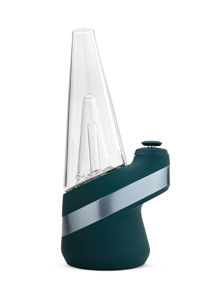 Side view of Puffco New Peak Pine e-rig highlighting angled glass top, ribbed grip, and silver accent band on the green base.