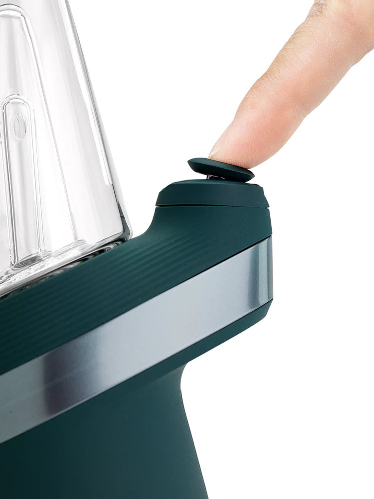 Closeup of Joystick Cap on Puffco New Peak Pine, finger pressing the top for directional airflow control.