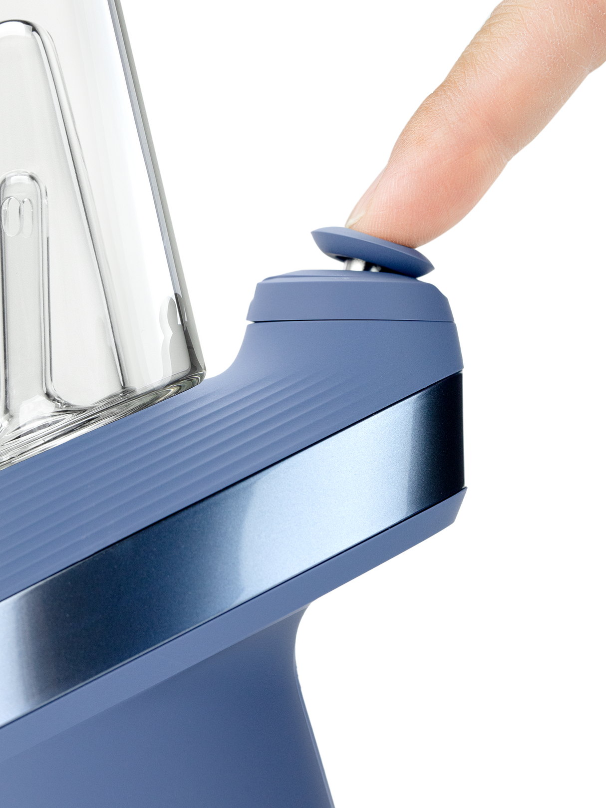 Puffco Peak Sapphire e-rig close-up showing finger pressing the blue Joystick Cap