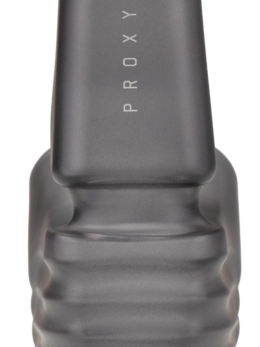 Close-up of Onyx Puffco New Proxy Wizard back section, smoky gray frosted glass with ribbed grip and vertical PROXY branding on the stem.