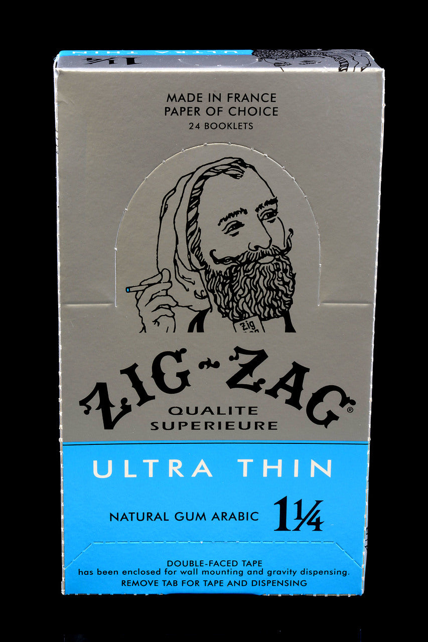 Closed 1¼ Zig-Zag Ultra Thin display case labeled Natural Gum Arabic; 24 booklets in silver and blue.
