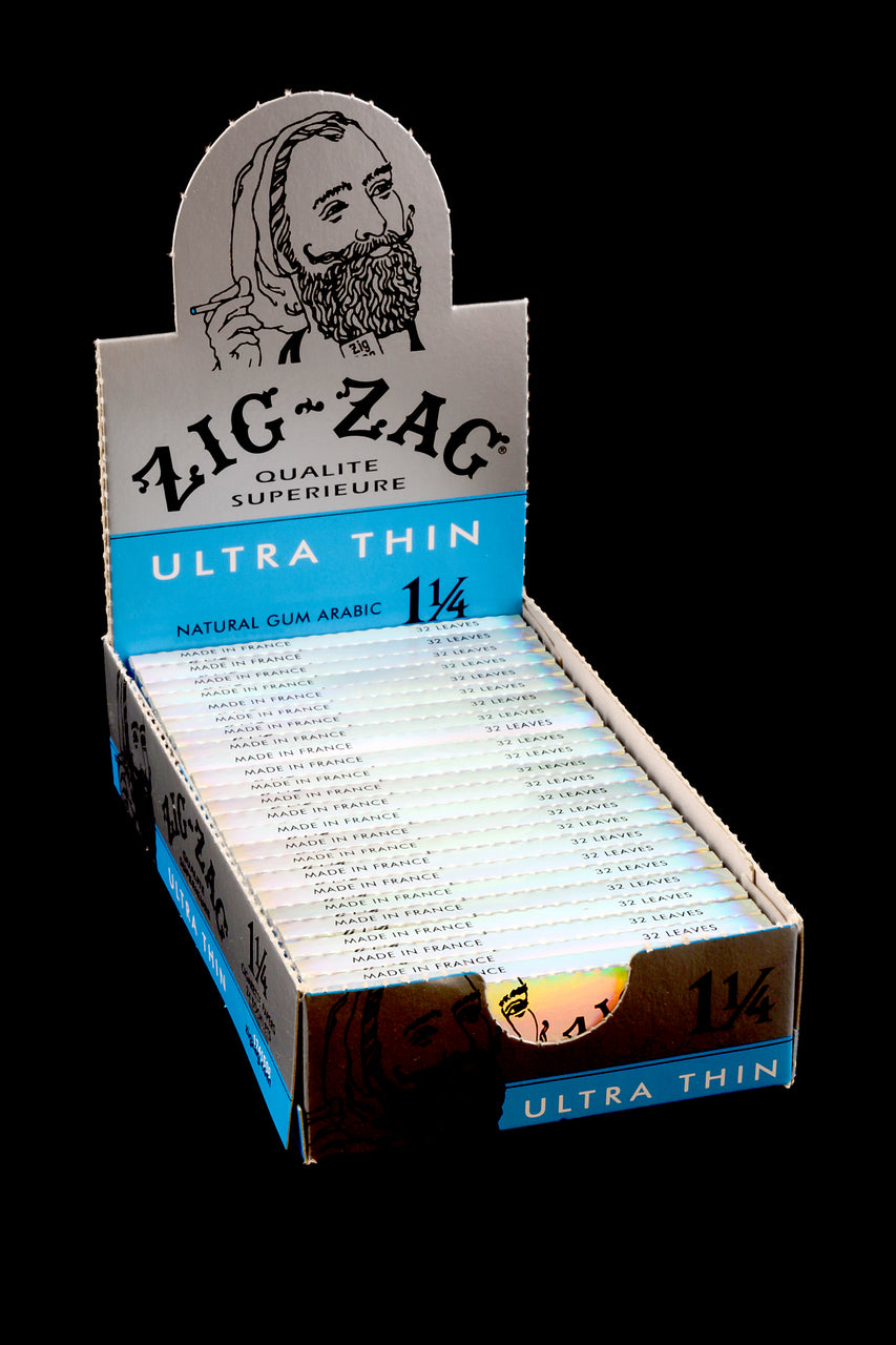 Open Zig-Zag Ultra Thin 1¼ display showing 24 packs with “Made in France” text and natural gum arabic callout.
