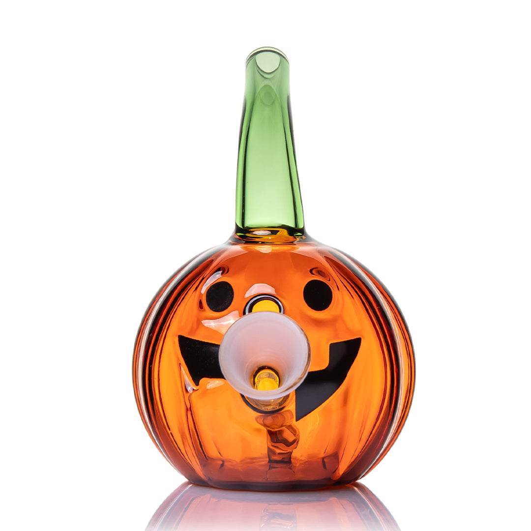 Jack O'Ripper glass bubbler front view highlighting the grinning jack-o'-lantern face and frosted cone holder