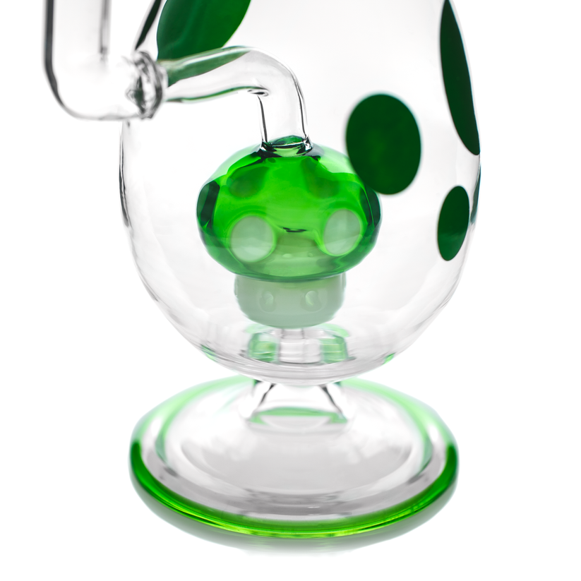 Detail shot of clear Hemper Spotted Egg XL bong with green perc and matching green spots clustered around the lower chamber.