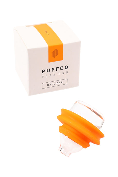 Orange Puffco Peak Pro ball cap accessory with glass cap and orange silicone ring, displayed next to the retail package.