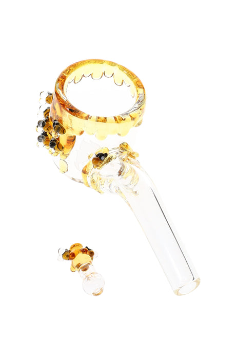 Clear glass Puffco Proxy Sherlock attachment with amber honey-drip rim and tiny bee accents; matching bee cap shown nearby.