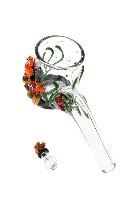 Clear glass Puffco Proxy Sherlock attachment with raised coral reef, clownfish, and starfish accents; matching cap beside.