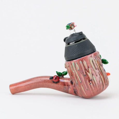 Rear angle of the Hootie attachment with flowing bark drips, leaves, and a tiny ladybug perched on the stem.