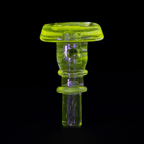 Standing view of UV-reactive Radioactive Puffco joystick glowing neon, rounded cap and control stem for concentrate sessions.