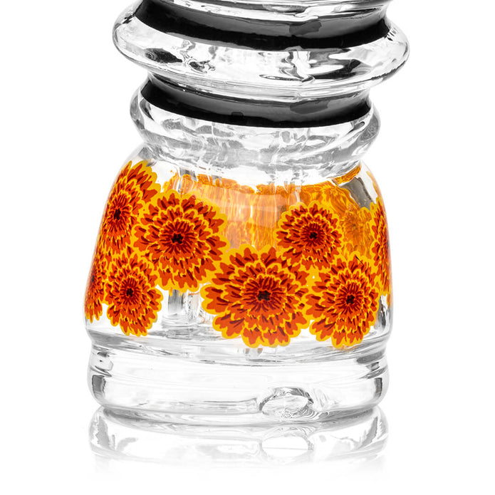 Close-up of marigold flower pattern inside the Peak top lower chamber, detailed glass design for display shots