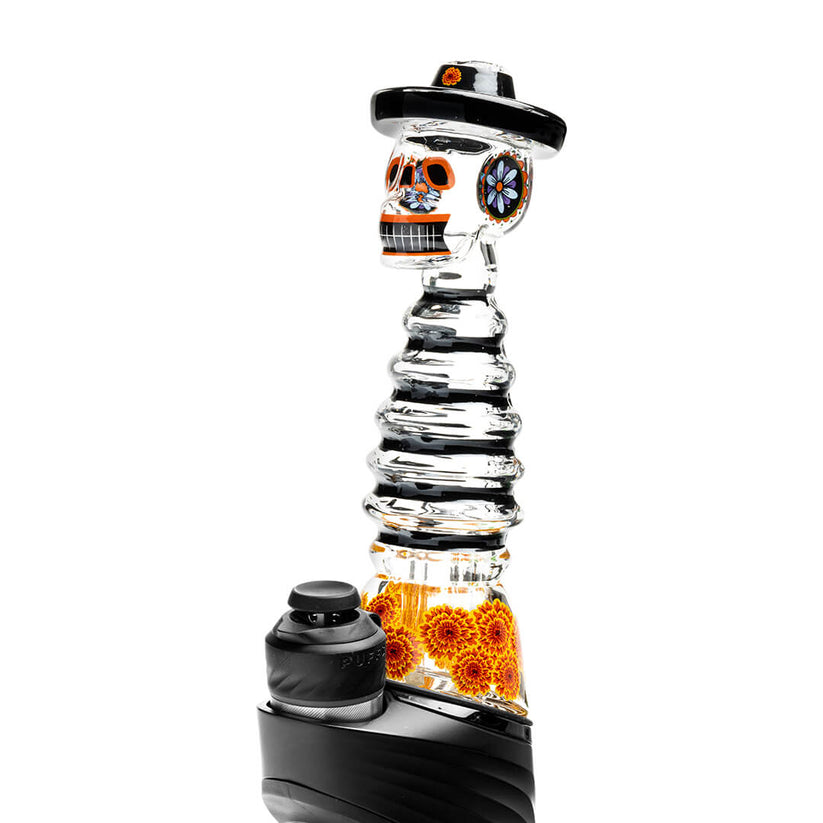 Side profile skeleton Peak top mounted on device base, showing floral ear detail and sculpted head silhouette