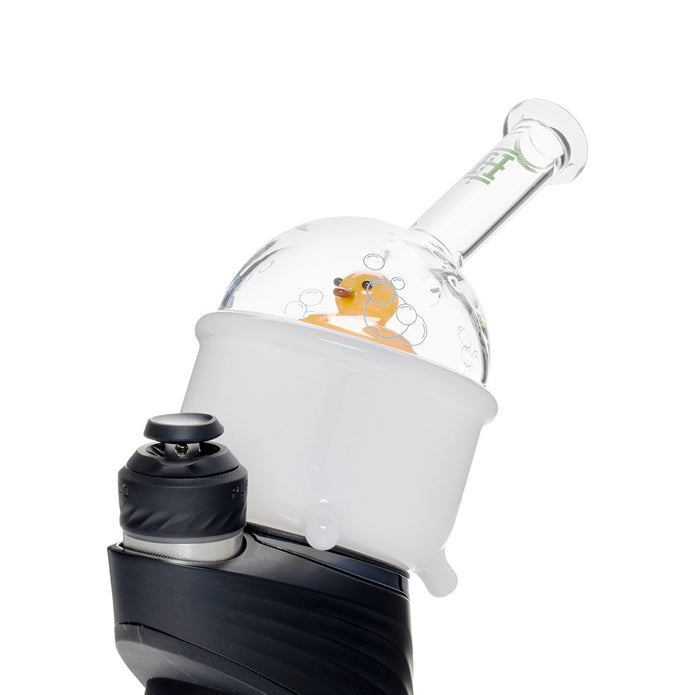 Tilted view of Ducky Peak attachment on device showing white tub base, bubble dome wrap, and angled mouthpiece