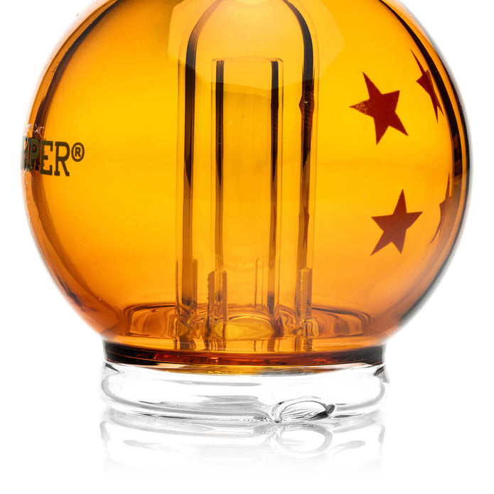 Close-up of orange orb chamber base with star graphics and glass foot, detail view of Hemper Peak top construction