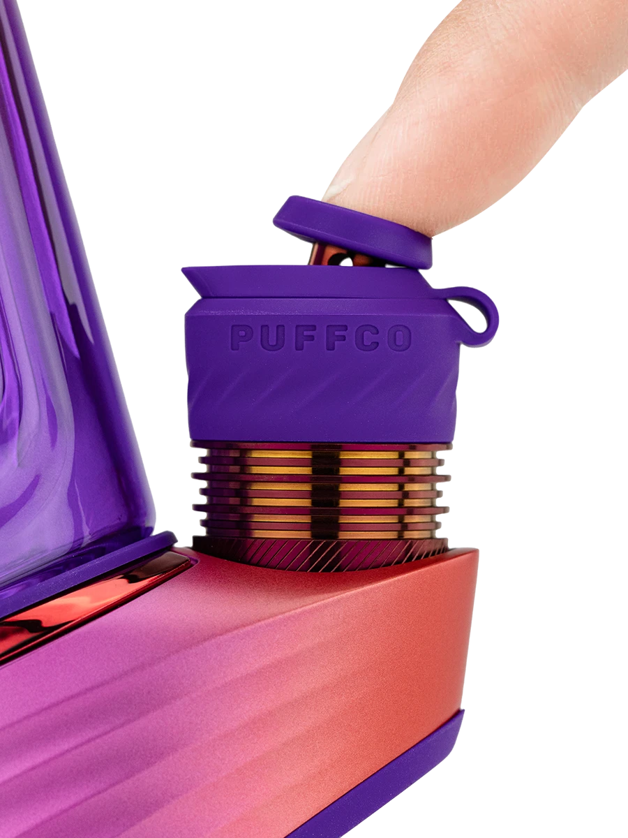 Close-up of a finger tilting the purple Joystick Cap on the Puffco Peak Pro Plasma 3DXL Chamber