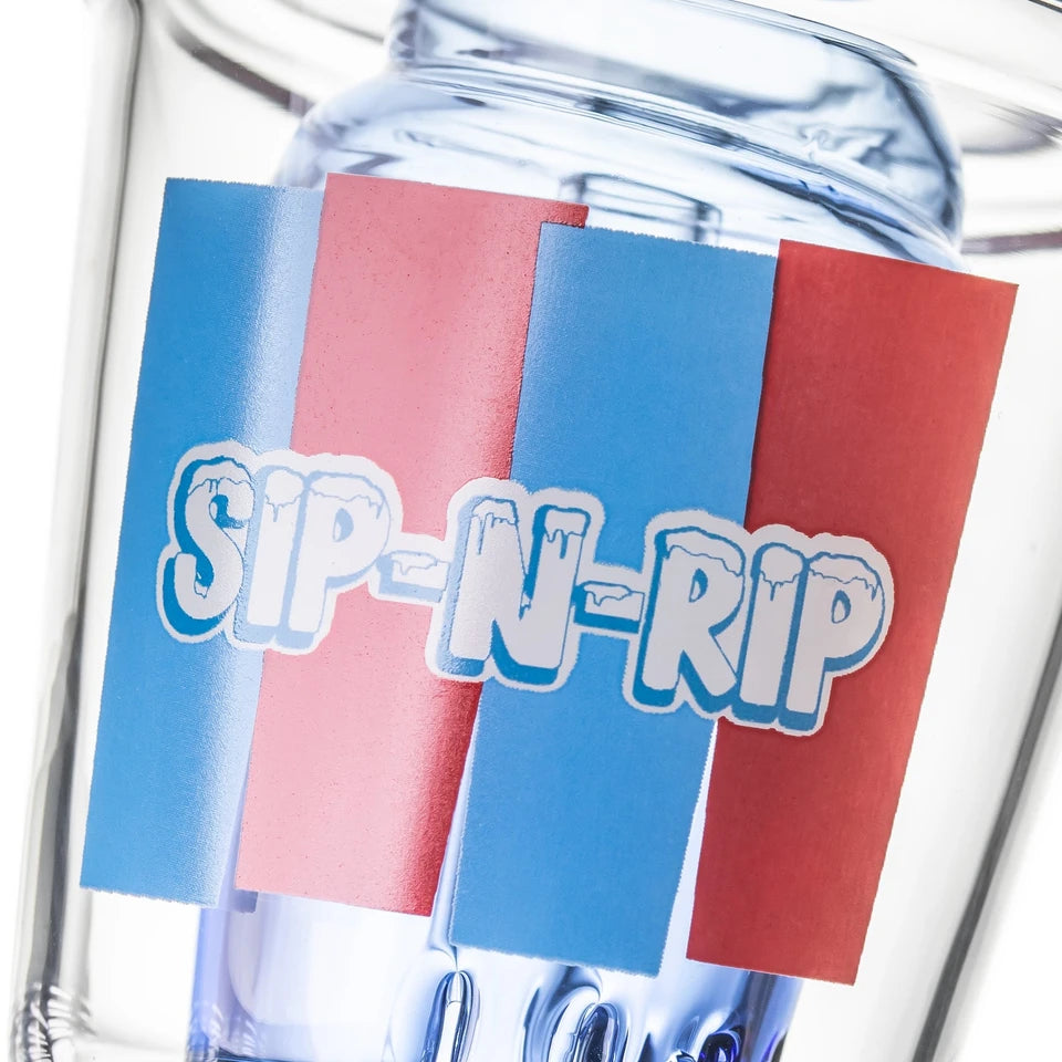 Close-up of BigFun! Sip-N-Dip Peak glass top showing red-blue SIP-N-RIP graphic over the blue inner chamber