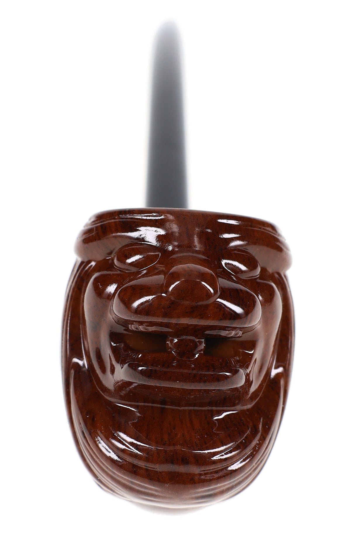 Close-up of glossy lion-face carved wood bowl on 16″ pipe, showing detailed carving and polished finish