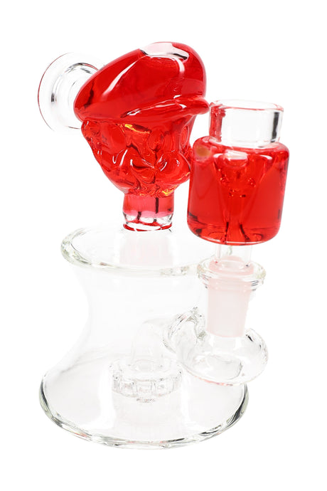Red-accent plumber-themed mini glass bong showcasing fluid-filled top piece, matching chamber, and showerhead perc.