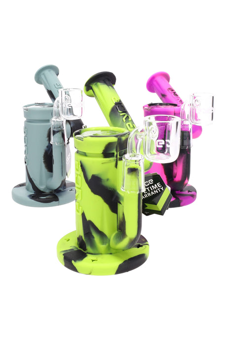 Silicone sidecar dab rig with rotating neck, 14 mm quartz bucket and built-in storage, shown in assorted colors.