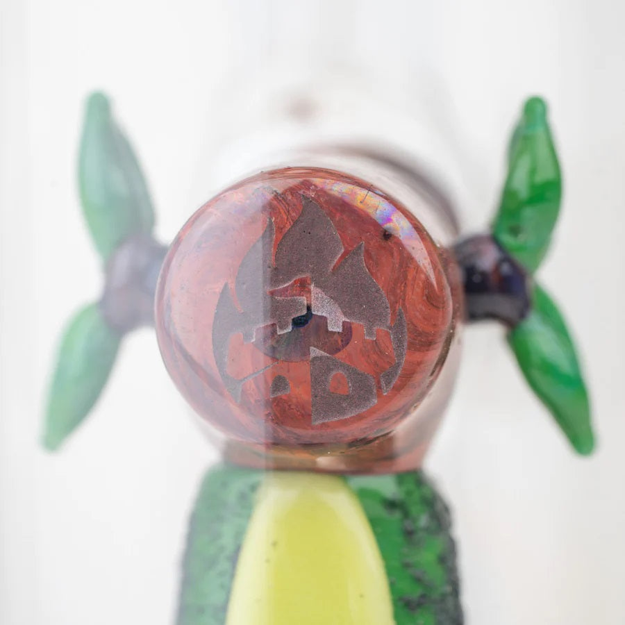 Top of the log accent on avocado mini tube showing etched emblem within the glass cabochon detail.