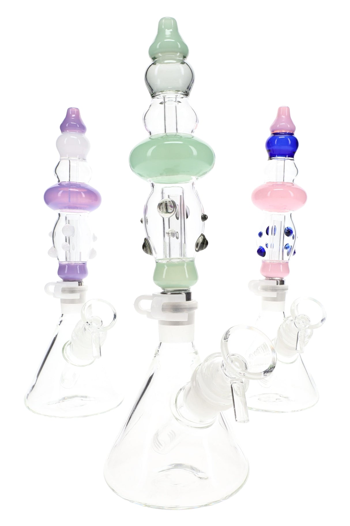 Three assembled Duo Namics kits in assorted pastel colors, each with clear beaker base and matching colored body section.