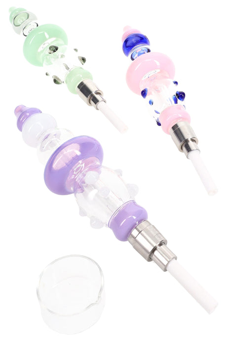 Dab straw configuration showing three colored glass bodies with heated tips attached and a small glass concentrate dish.