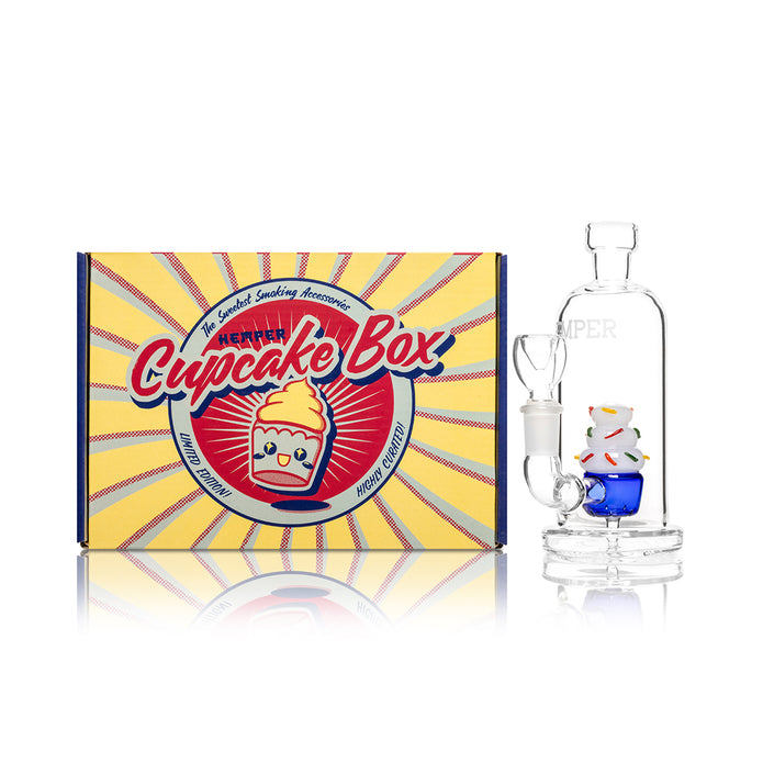 Hemper cupcake bong next to Sugar High retail packaging, small-footprint glass bong for smooth filtered dry herb pulls