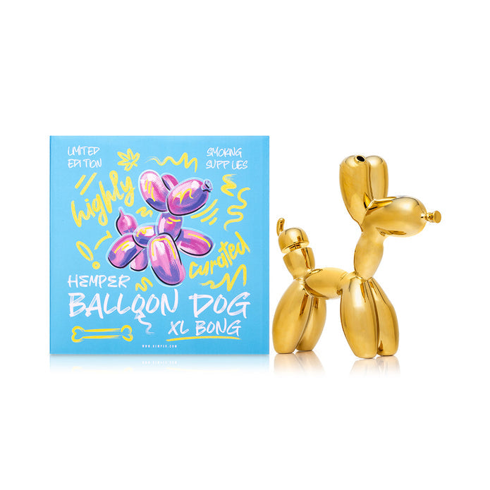 Gold balloon dog glass bong posed beside Hemper box, reflective gold finish with 14.5 mm bowl included