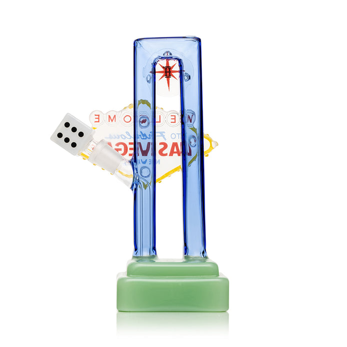 Rear view Las Vegas sign glass bong showing back panel silhouette, green base footing, and sturdy 8″ display shape