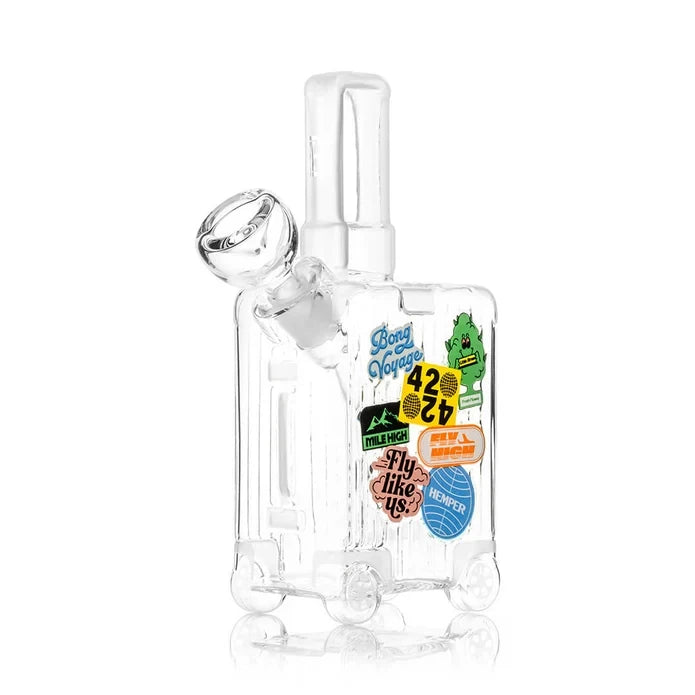 Angled front view of the HEMPER Suitcase Medium Bong showing its clear bowl, glass handle, and wheel details