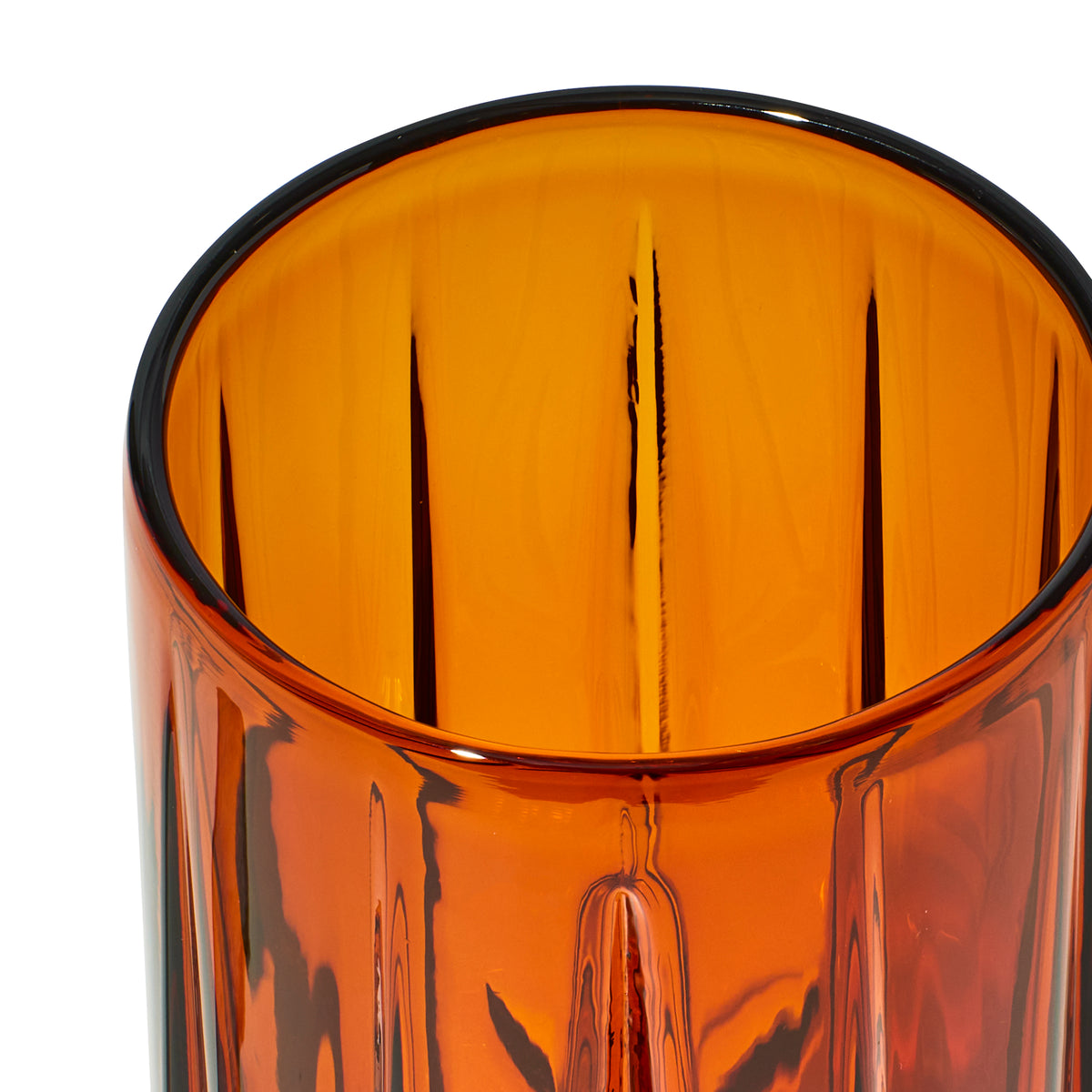 Close-up inside Baltic Amber Highball gravity bong shell showing its thick rim and vertical glass facets