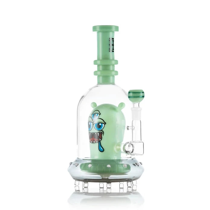 Angled view of green Hemper Space Monster XL bong with a matching bowl, clear dome and saucer-shaped base