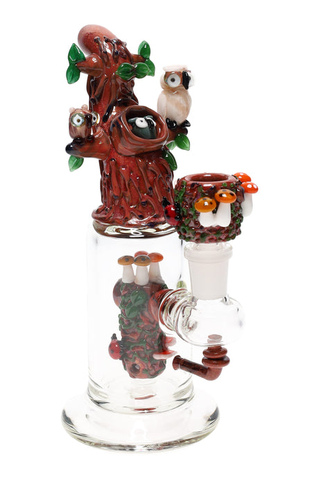 US-made Empire Glassworks mini rig with tree and owl sculpture, 14 mm female joint, and clear can-style chamber on a thick base.