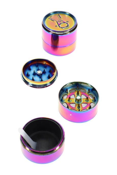 Rainbow 3-part metal soda can herb grinder, 1½″ size with mesh screen and kief scraper, compact zinc-alloy design shown disassembled.