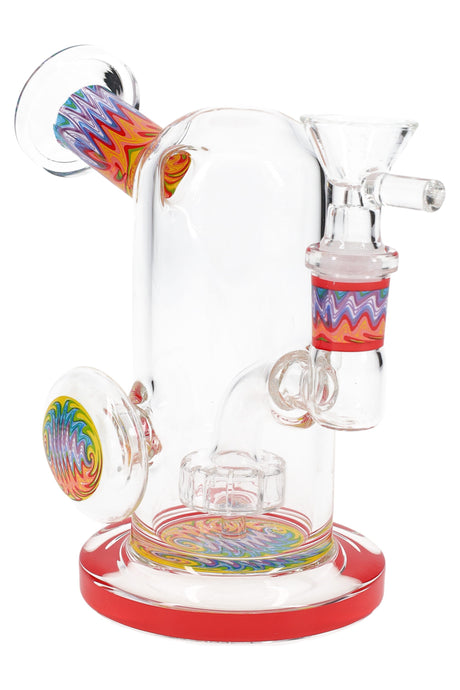 Clear 5″ mini bong with red base and reverse swirl sectioning, side grip marble, and showerhead percolator.