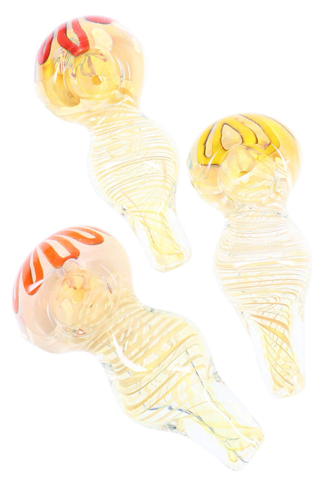 4-inch silver-fumed glass spoon pipe with spiral ribbon design, rounded bowl, and side carb, shown in assorted honey-toned colors.