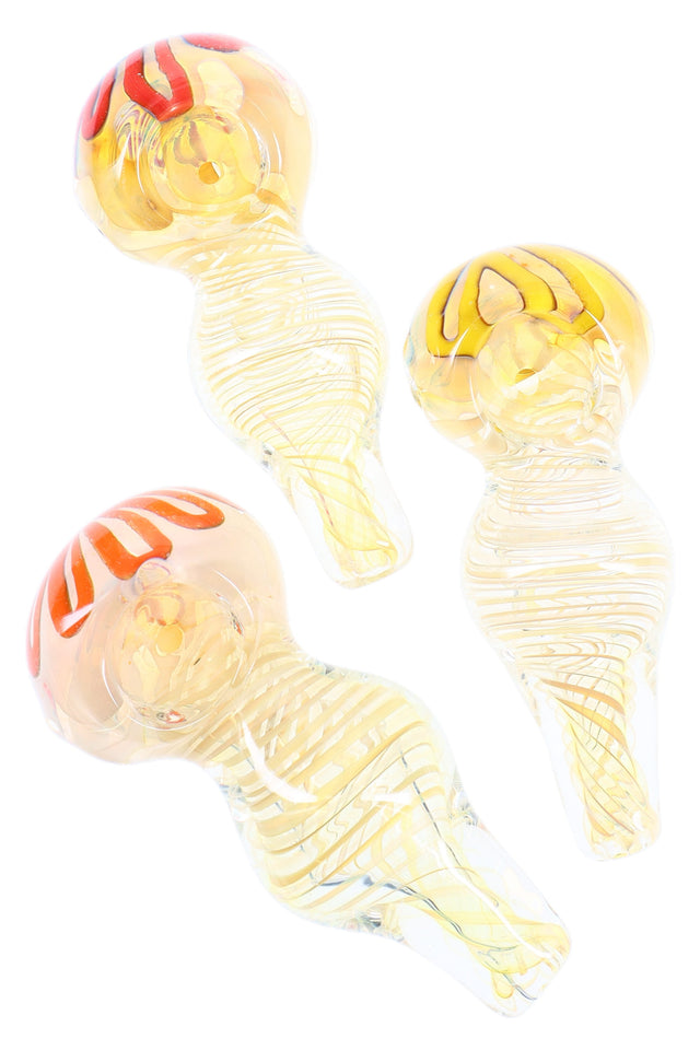 4-inch silver-fumed glass spoon pipe with spiral ribbon design, rounded bowl, and side carb, shown in assorted honey-toned colors.
