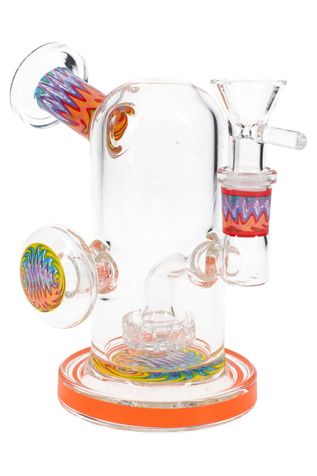 Clear 5″ mini bong with orange base, reverse worked details, 14.5 mm female joint, and side grip marble.