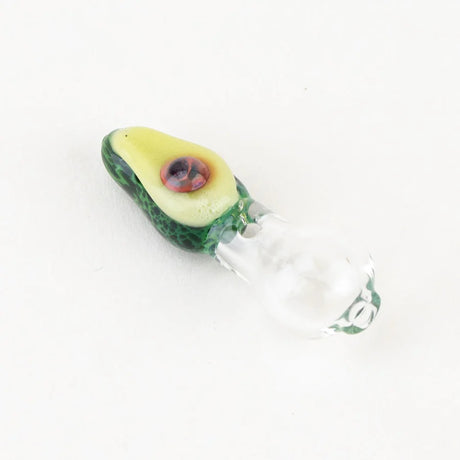 Close-up of Empire Glassworks avocado ball cap showing speckled green peel and light yellow “flesh,” clear glass base attached.
