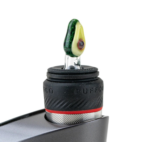 Avocado ball cap installed on a Puffco Peak Pro, standing upright in the rubber collar to show fit and scale.